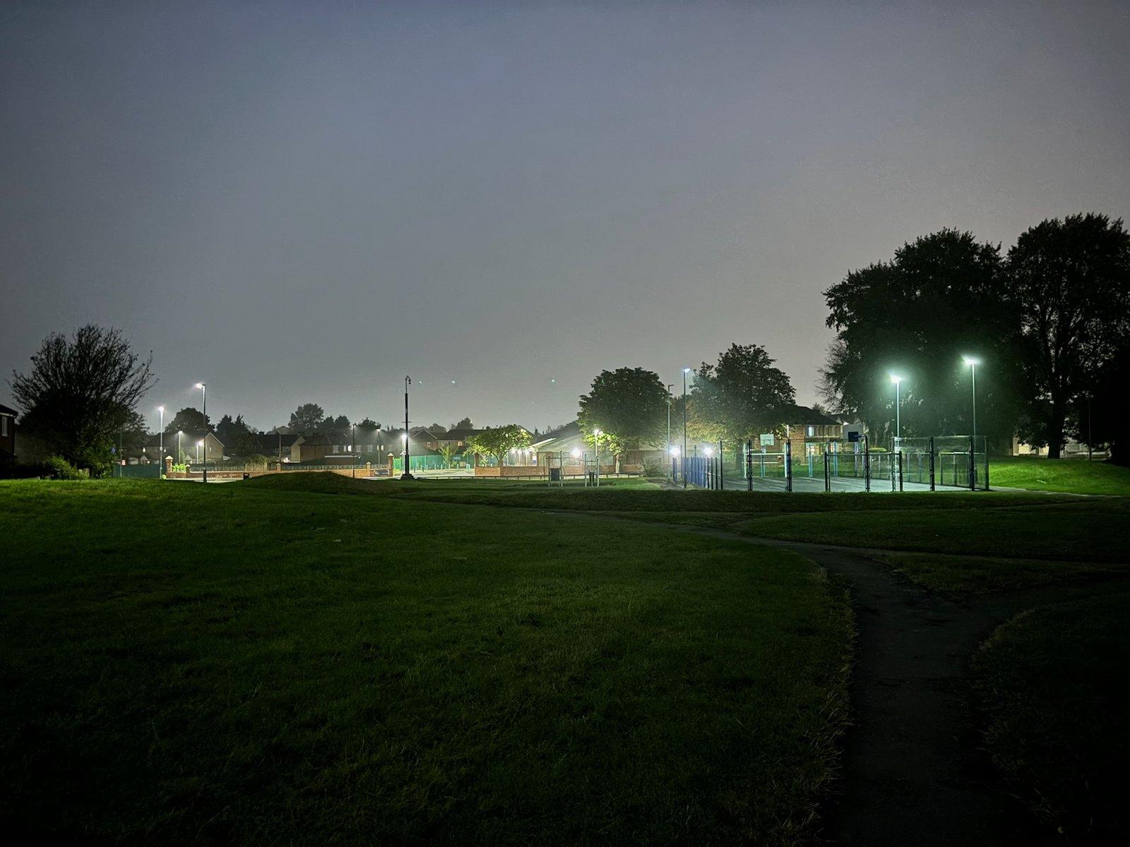 one of the recreation grounds in the dark with floodlights'